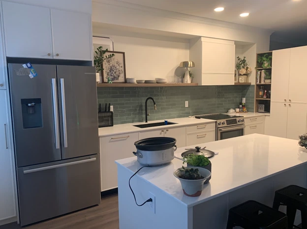 Modern kitchen with refaced cabinets, new doors, and updated hardware
