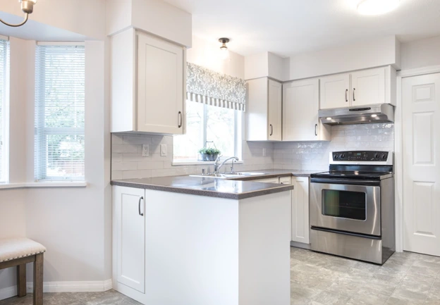 Bright kitchen with new cabinets and full cabinet replacement renovation